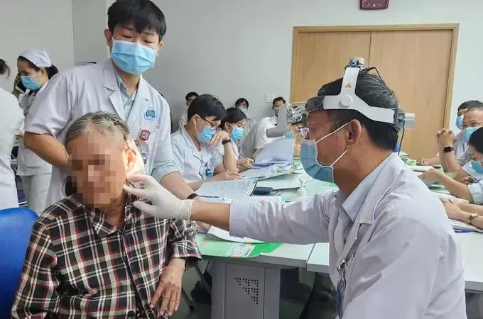 Doctors at Ho Chi Minh City Oncology Hospital examine a patient.
